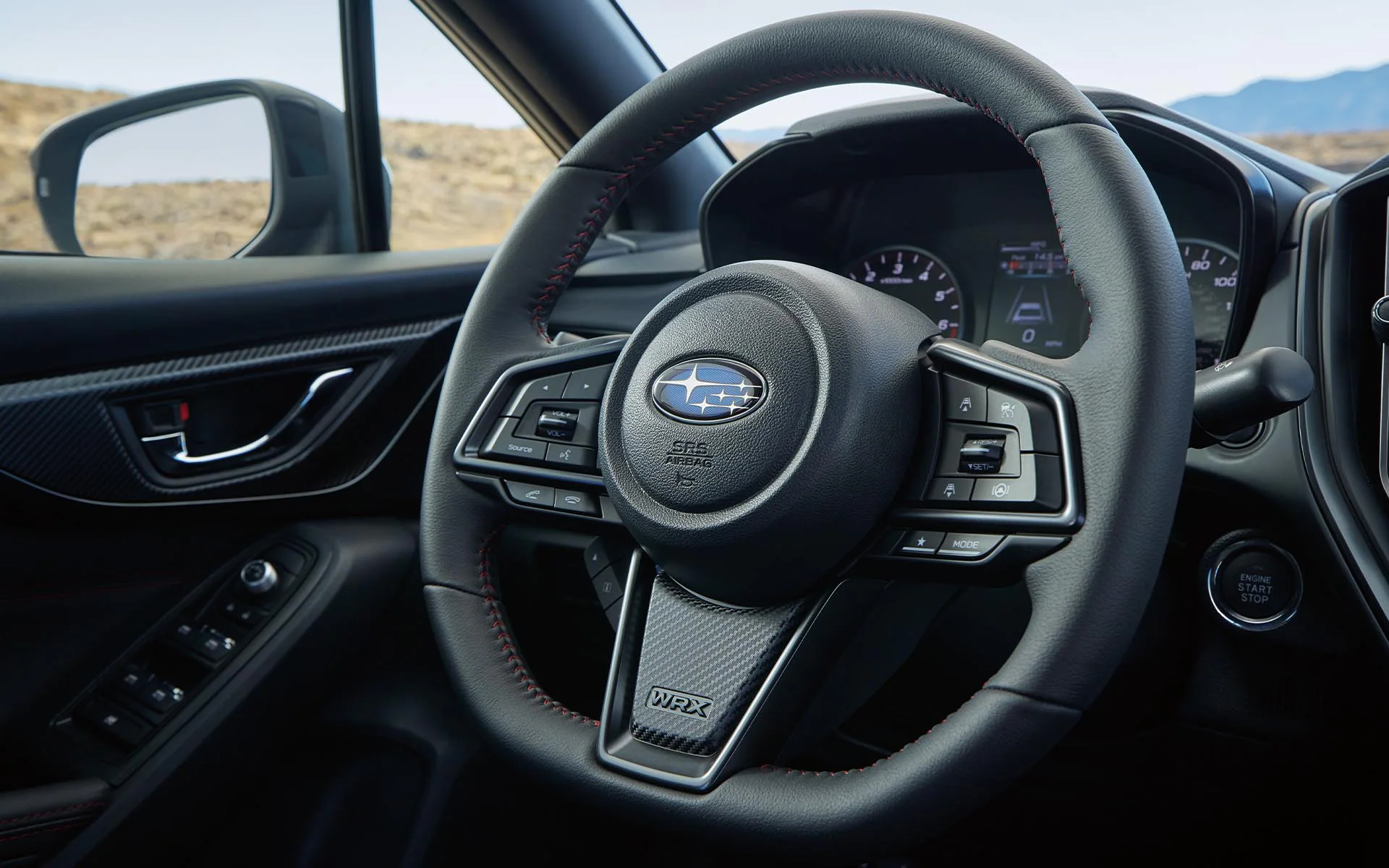 A close up of the D-shaped steering wheel in the 2022 Subaru WRX